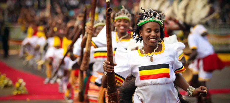Dancers in Uganda colours performing a welcome